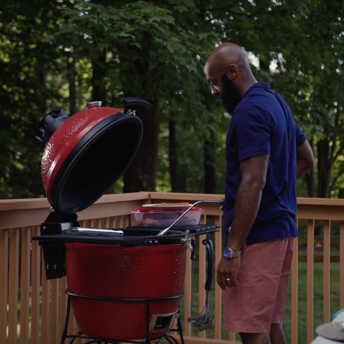 Man grilling on kamado joe charcoal
