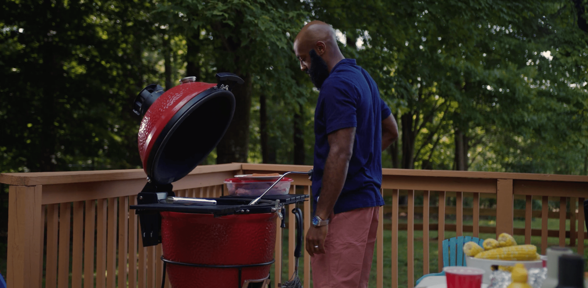 Man grilling on red egg with Rocketfire