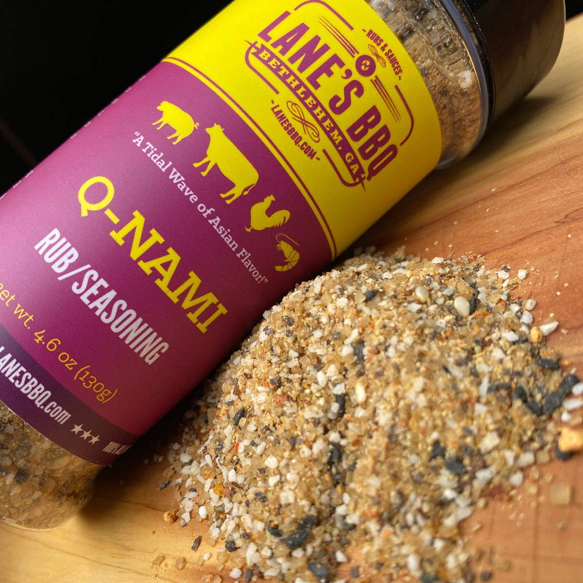 Lane's BBQ Q-Nami seasoning on a wooden surface