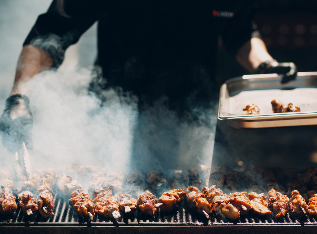 Smoking meat on charcoal grill on sale